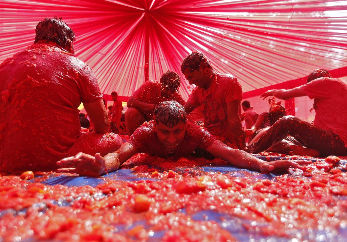 People played with tomato pulp as part of the Holi celebrations in the western Indian city of Ahmedabad on March 6. (Amit Dave/Reuters)