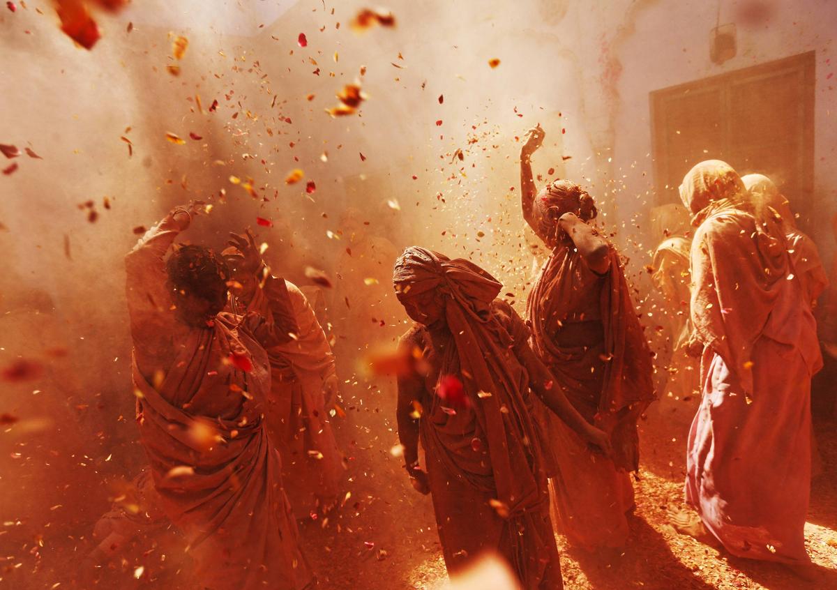Widows daubed in colors danced as they took part in the Holi celebrations organized by nongovernmental organization Sulabh International in the northern Indian state of Uttar Pradesh on March 6. Traditionally in Hindu culture, widows are expected to renounce earthly pleasure so they do not celebrate Holi. But widows at the shelter, who have been abandoned by their families, celebrated the festival by throwing flowers and colored powder. (Adnan Abidi/Reuters)