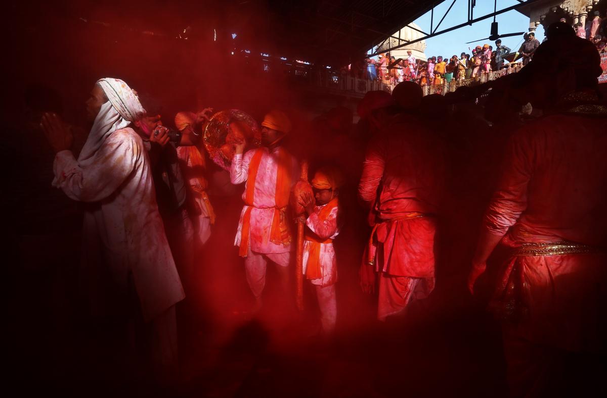 Hindu men from the village of Nandgaon prayed at the Ladali, or Radha temple, before joining a procession for the Lathmar Holi festival in Barsanai, India. (Saurabh Das/Associated Press)