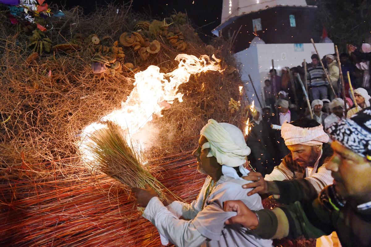Indian men set alight a huge bonfire in the northern town of Phalem before dawn on March 6. Hundreds of villagers from the farming town crowded rooftops and a small square as a Hindu priest walked through a raging fire in a ritual that marks the burning of demon Holika on the day of Holi. (Roberto Schmidt/AFP/Getty Images)