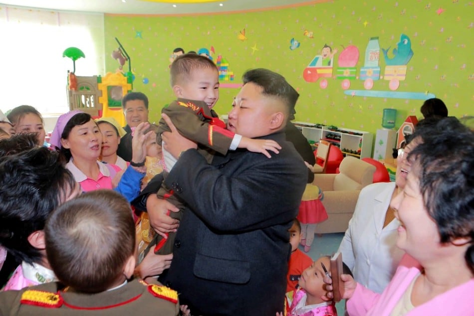 North Korean leader Kim Jong Un (L) visits the Pyongyang Baby Home and Orphanage on New Year's Day in this photo released by North Korea's Korean Central News Agency (KCNA) in Pyongyang January 2, 2015. (Photo by Reuters/KCNA)