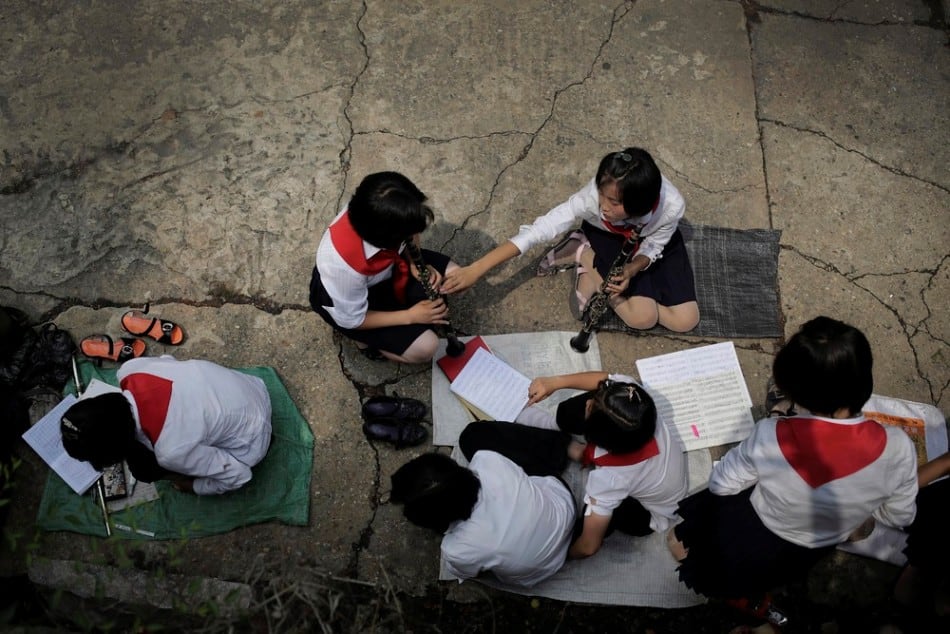North Korean students practice playing their musical instruments at the Moranbong or Moran Hill, Thursday, July 31, 2014 in Pyongyang, North Korea. (Photo by Wong Maye-E/AP Photo)