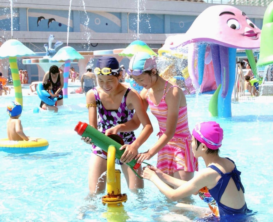 Laborers and youth visit Munsu Water Park during a continued period of hot weather in Pyongyang August 8, 2014. (Photo by Reuters/KCNA)