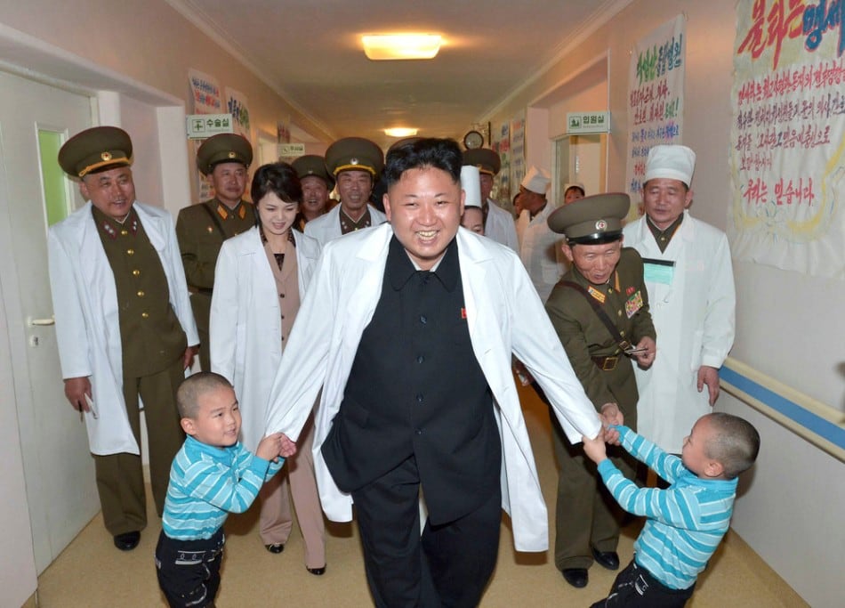 North Korean leader Kim Jong Un plays with children during a visit to the Taesongsan General Hospital in Pyongyang May 19, 2014. (Photo by Reuters/KCNA)