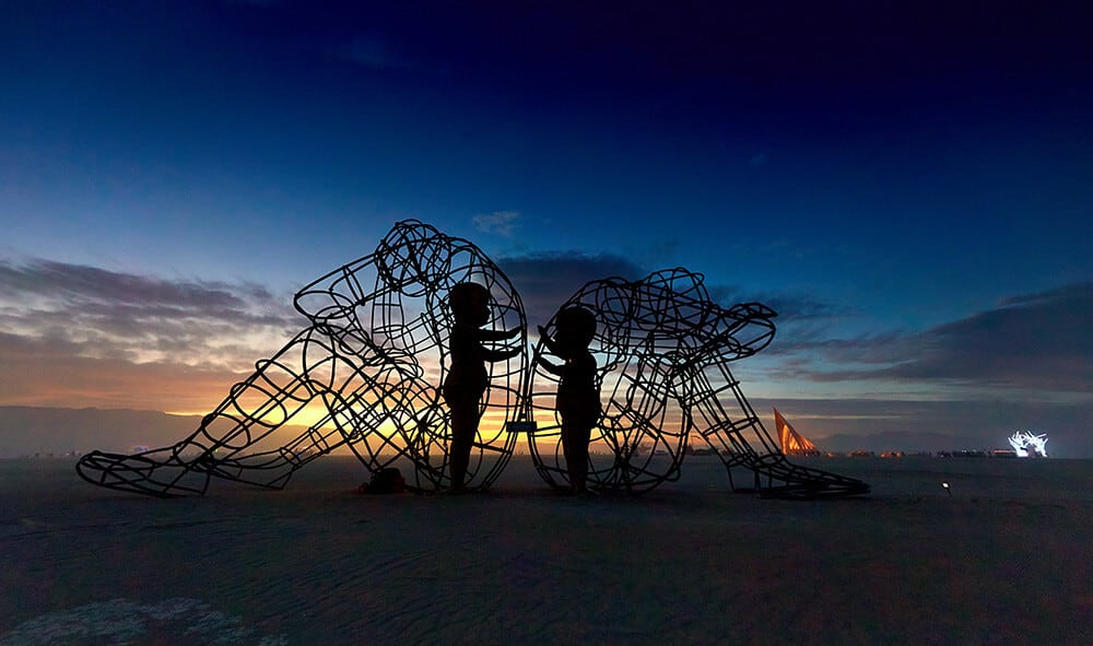 Powerful Sculpture At Burning Man Shows the Glowing Forms of Children