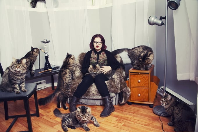 Alex with Dali the cat. (Andreanne Lupien/Caters News)