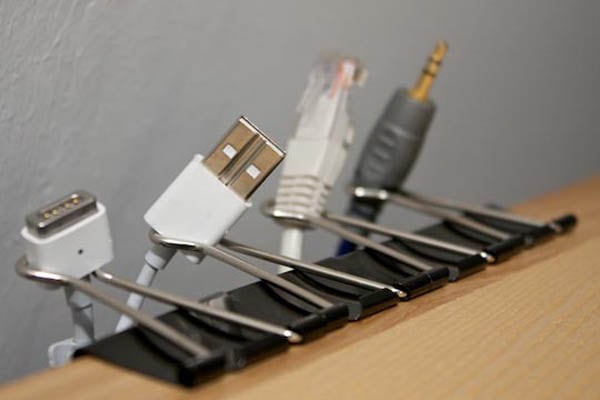 paperclips to ogranize cables paperclips clipped onto side of table using handles to organize cables