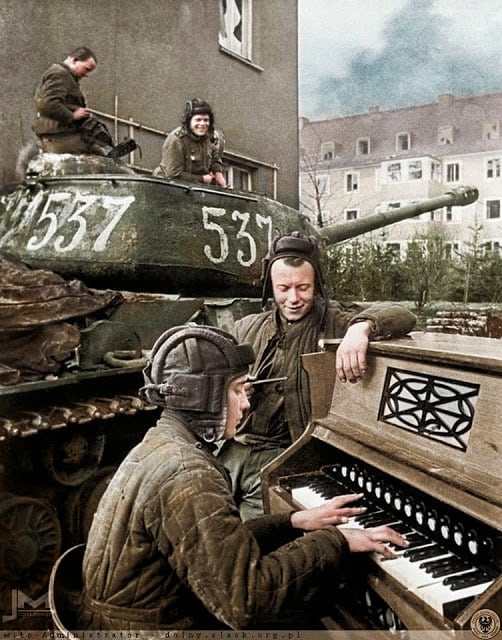 Crew members of Nº537 Soviet IS-2 tank of the 87th Guards Heavy Tank Regiment take a break in Breslau (now Wrocław in Poland) 27th April 1945. (Photographer - Anatoli Egorov. Colorized by Jiří Macháček from the Czech republic)