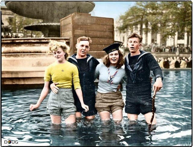 Two British sailors celebrate VE Day with their girlfriends in the fountains at Trafalgar Square. London, England. Tuesday the 8th of May 1945. (Source - © IWM EA 65799. United States Army Signal Corps photographer T G Massecar. Colorized by Doug)