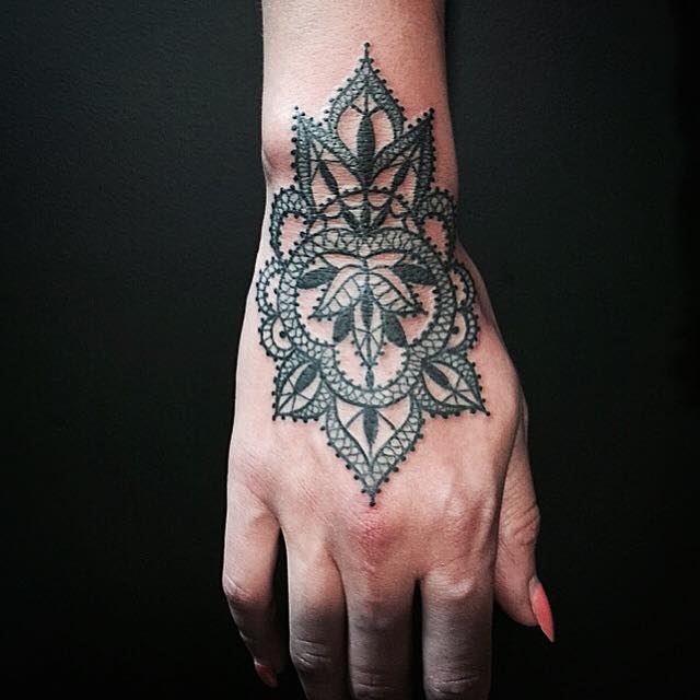 elegantly detailed tattoos mimic the delicate lacework of embroidery elegantly detailed tattoos mimic the delicate lacework of embroidery