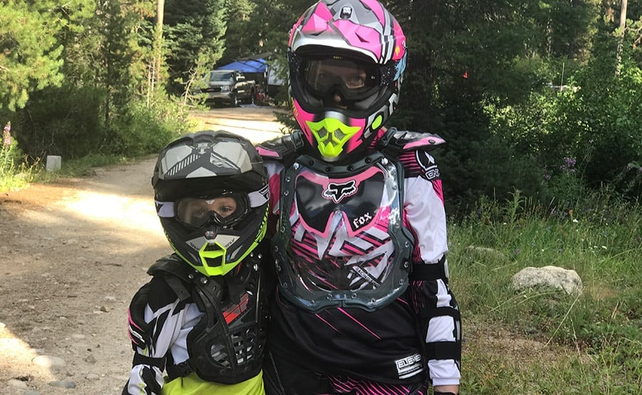 A young child wearing a helmet
Description automatically generated